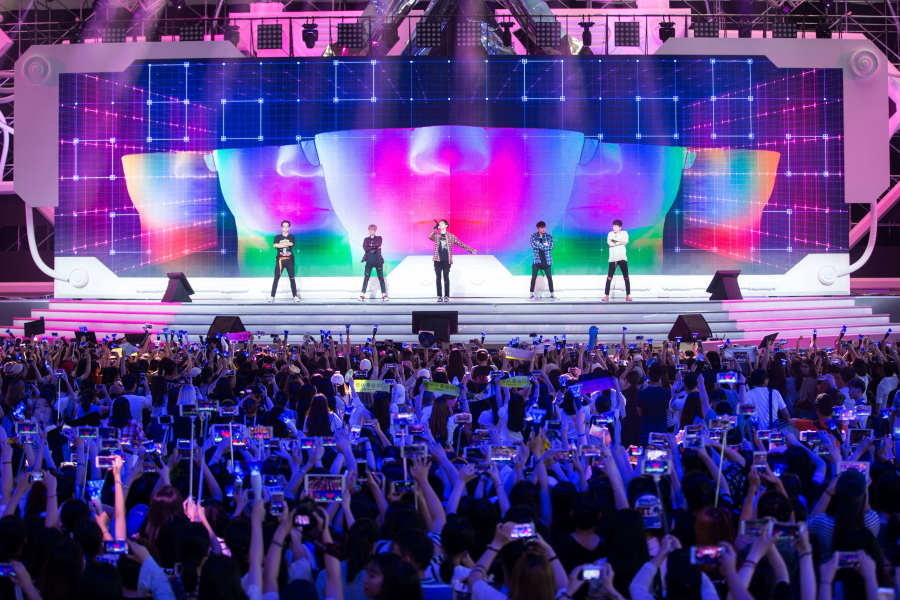 Chinese fans take photos of the South Korean K-Pop group Winner during a concert in Shanghai. Chinese anger at South Korea over its decision to deploy an U.S. anti-missile defense system appears to be threatening everything from appearances by the stars of K-Pop to future cooperation on North Korea at the United Nations.