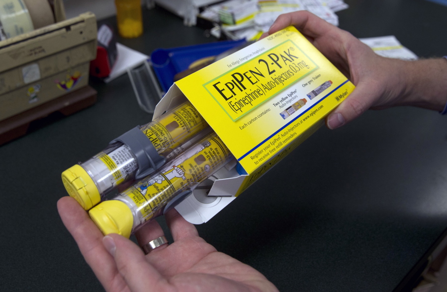 A package of EpiPens, an epinephrine autoinjector for the treatment of allergic reactions is displayed in Sacramento, Calif. Lawmakers are demanding more information on why the price for live-saving EpiPens has skyrocketed. EpiPens are used largely by children to ward off potentially fatal allergic reactions, and its price has surged in recent years. A two-dose package cost less than $60 nine years ago. The cost is now closer to $400.