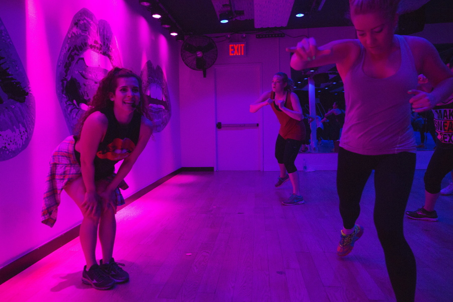 Sadie Kurzban, left, leads the Cardio Arms class at 305 Fitness in New York. Kurzban, owner of 305 Fitness, a hip-hop dance workout with a live DJ, says drill sergeant-style putdowns and body-shaming comments from instructors are ultimately counterproductive for clients, some of whom already have body insecurities.