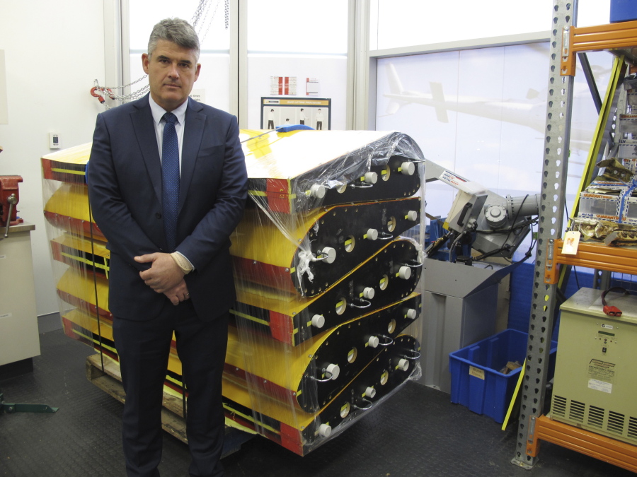 Peter Foley, Australian Transport Safety Bureau director of Flight 370 search operations, stands beside a stack of replica wing flaps on Thursday  at the bureau&#039;s headquarters in Canberra, Australia.