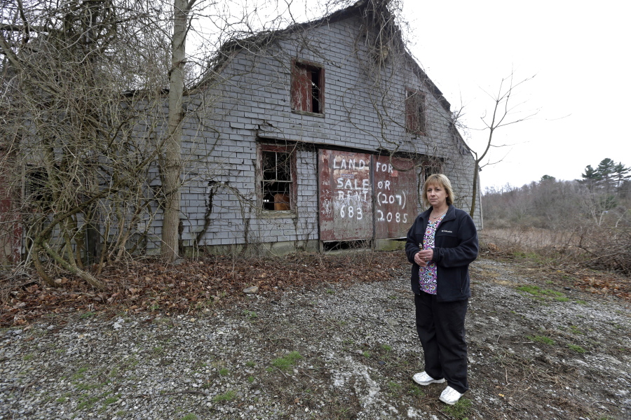 Desiree Moninski, stands on land located across from her house in Dudley, Mass., which is the site of a proposed Muslim cemetery. Federal prosecutors have opened an investigation into whether civil rights laws were violated by the town of Dudley that has rejected plans for the Muslim cemetery.