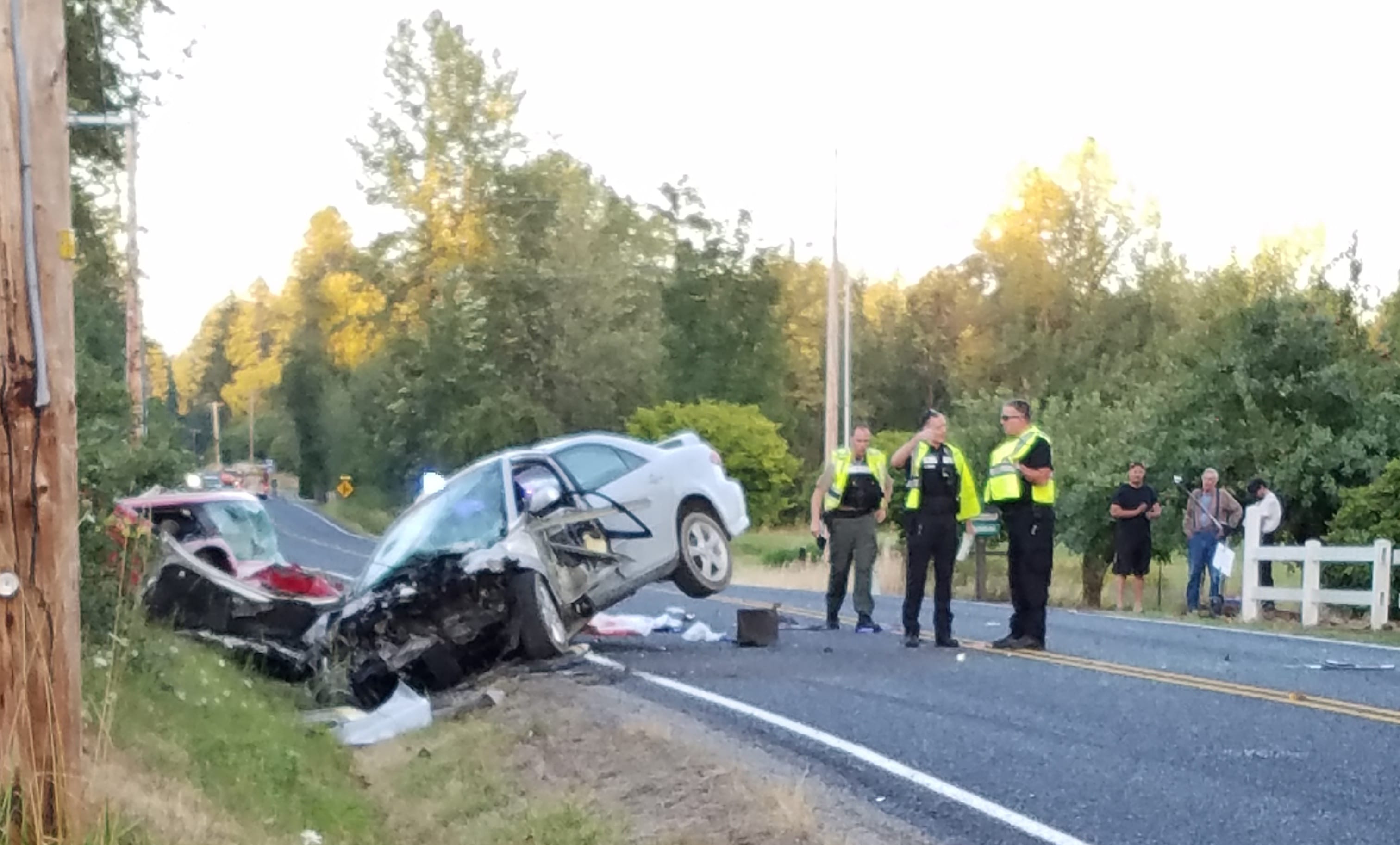 Deputies from the Clark County Sheriff's Department investigate a head-on crash in the 4400 block of Northeast 259th Street on Saturday.