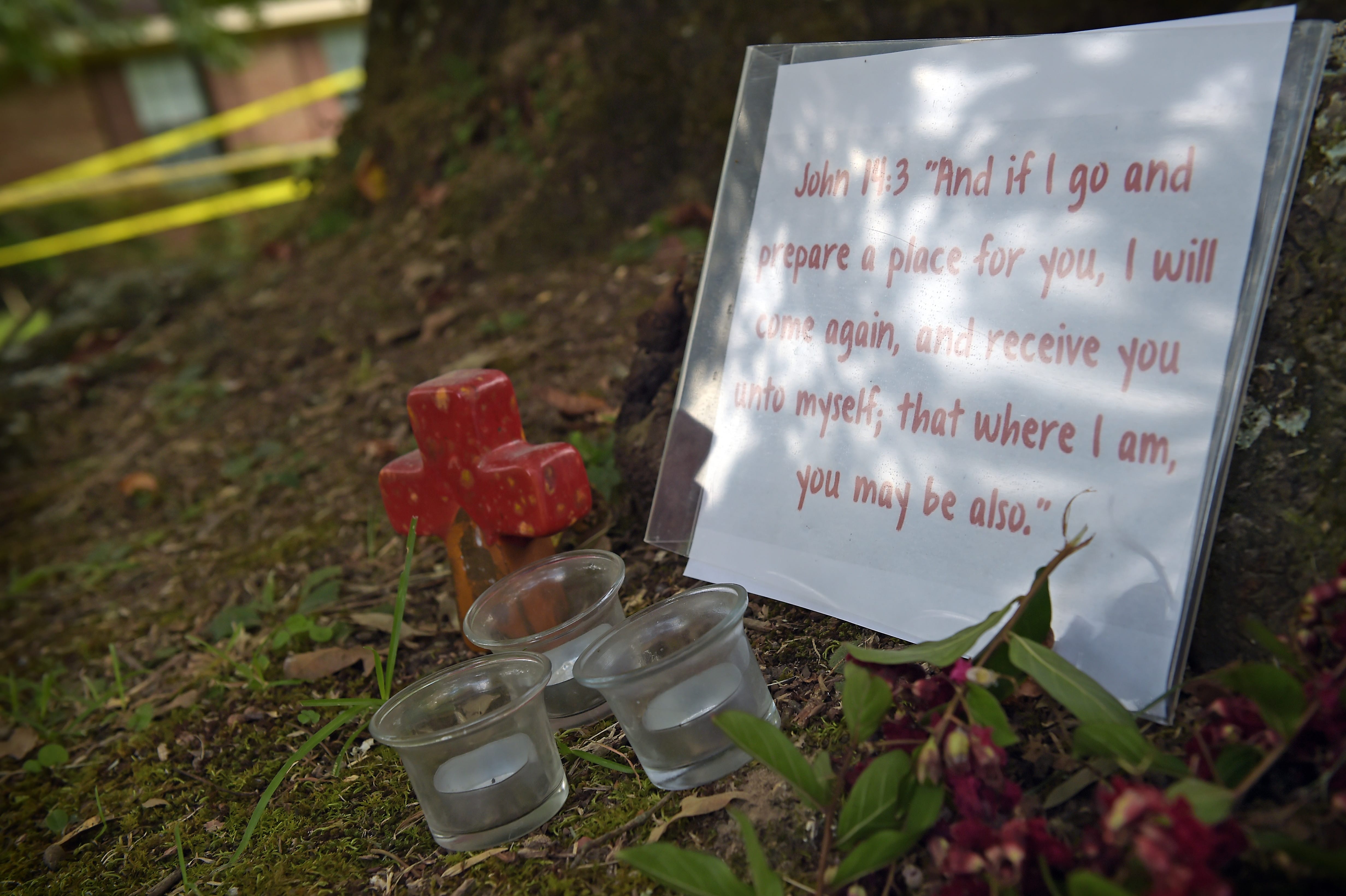 A memorial is placed outside the Crime scene tape at the home in Durant, Miss., Friday, Aug. 26, 2016, where Sister Margaret Held and Sister Paula Merrill were found slain Thursday morning.