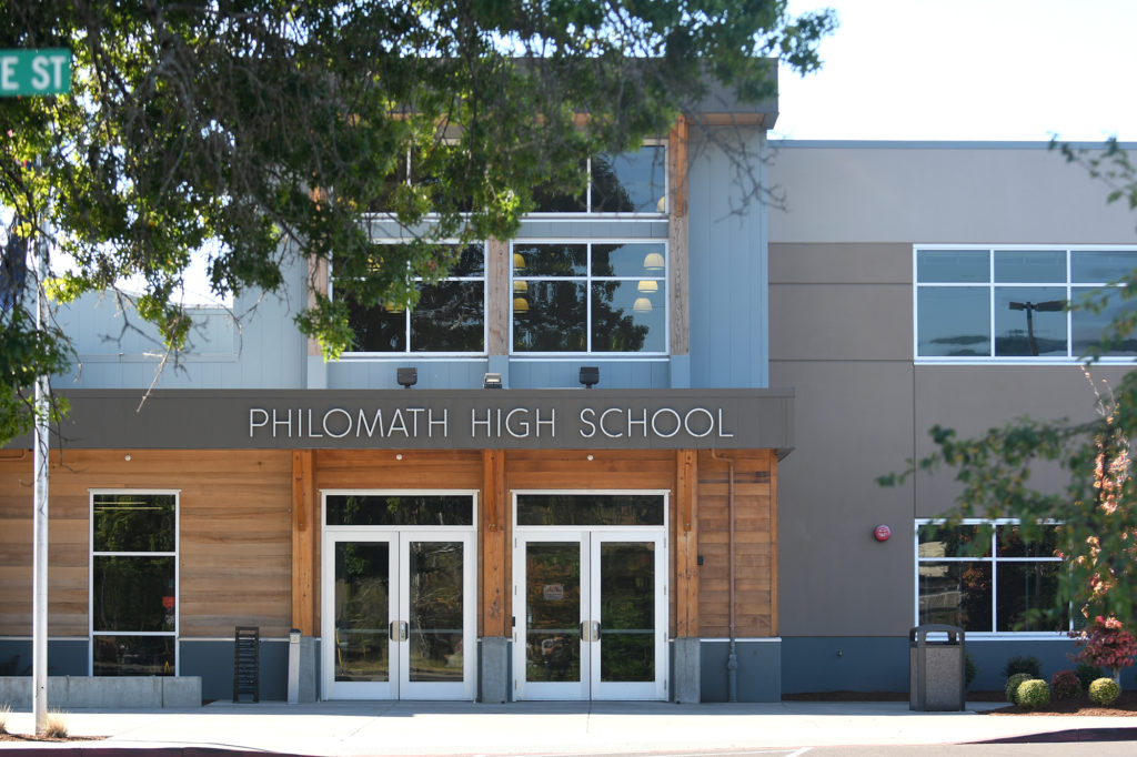Philomath High School is shown Monday, Aug. 29, 2016, in Philomath, Ore. Authorities say six Philomath High School football players and a 22-year-old volunteer assistant face charges after freshmen were subjected to hazing during the team's summer camp.