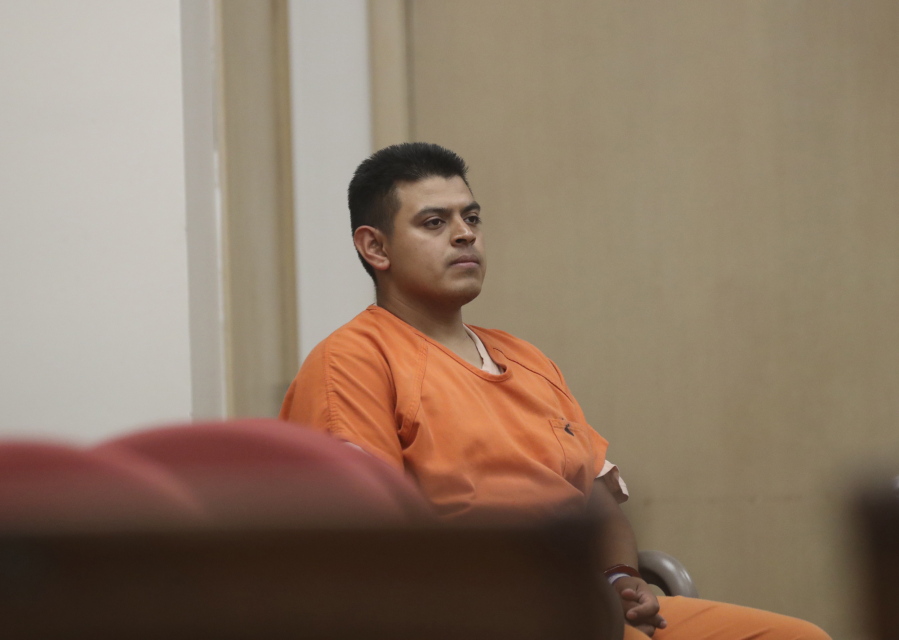Edwin Lara, a security guard at Central Oregon Community College in Bend, Ore., waits in court in Yreka, Calif., for his arraignment.