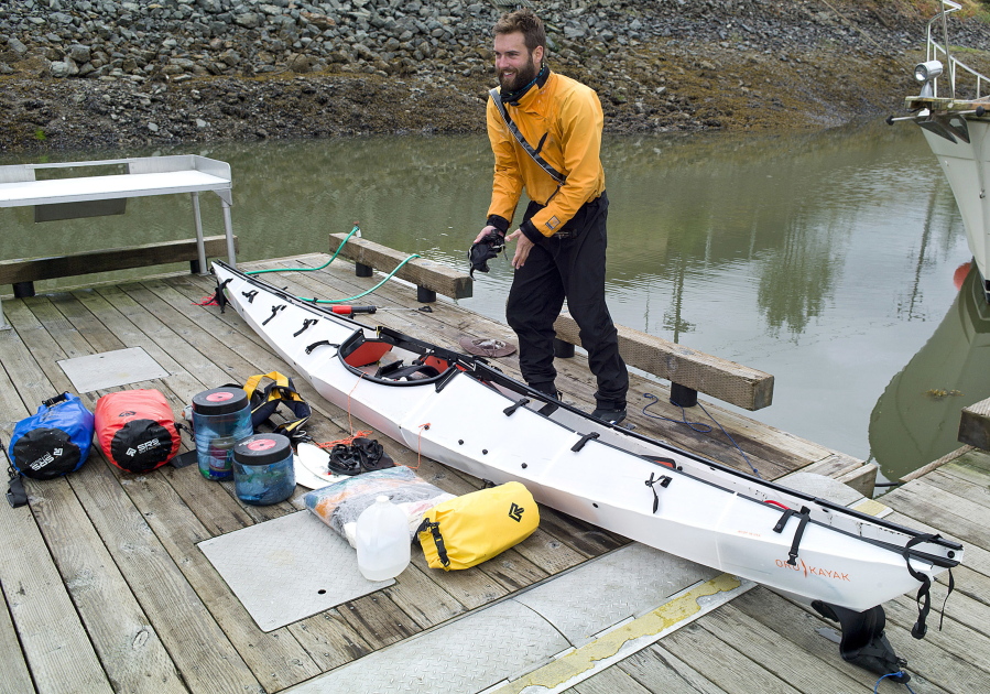 ADVANCE FOR RELEASE SATURDAY, AUG. 6, 2016 AND THEREAFTER In this July 25, 2016 photo, Austin Jones unpacks his foldable kayak in Juneau, Alaska, after finishing a trip from Anacortes, Washington, to Juneau. Jones&#039; &quot;origami kayak,&quot; as the manufacturer&#039;s website puts it, looks like it&#039;s made out of corrugated cardboard, something more suited to campaign signs than open seas.