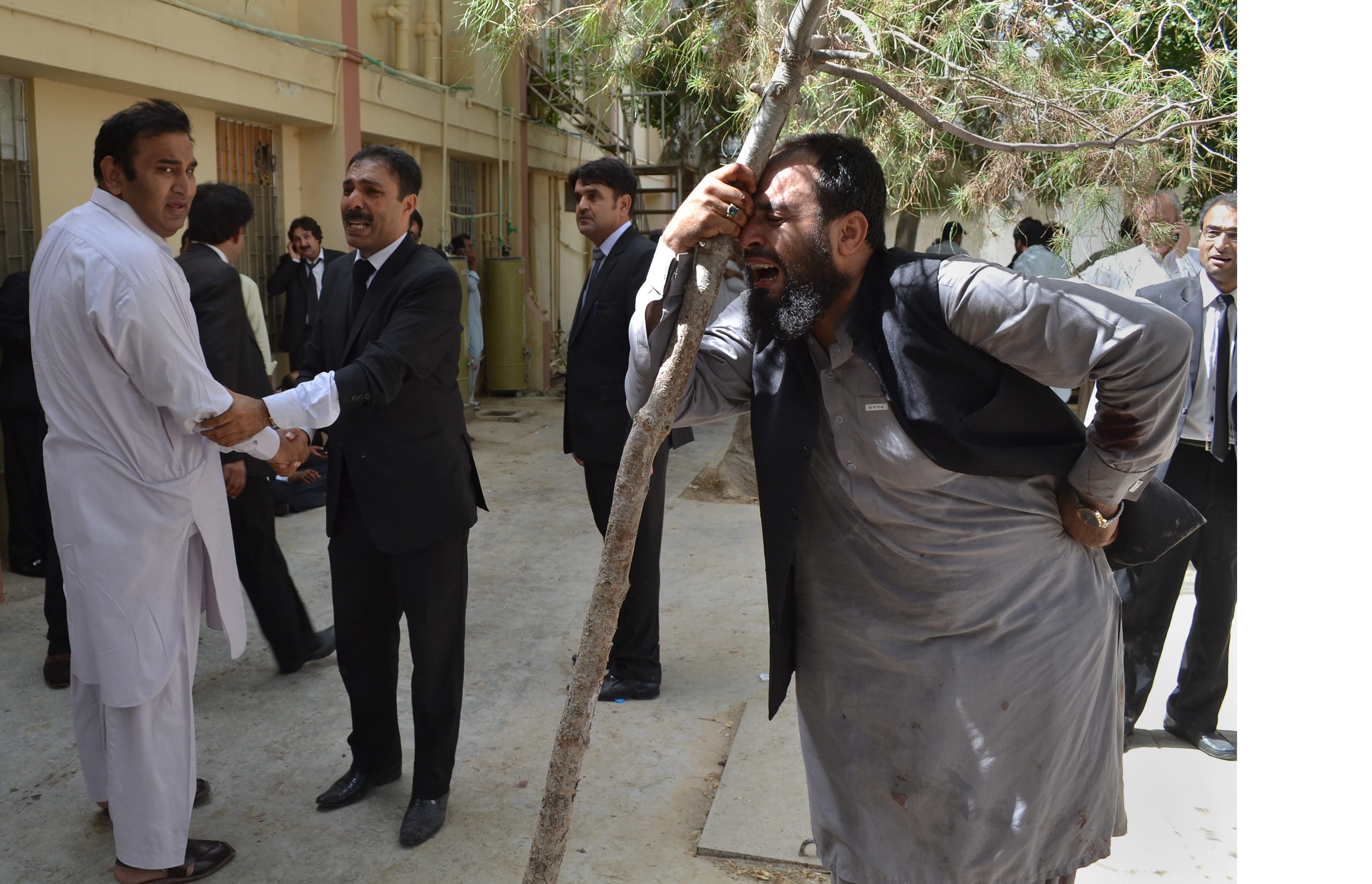 Pakistani lawyers mourn the deaths of their colleagues following a bomb blast in Quetta, Pakistan, Monday, Aug. 8, 2016. A powerful bomb went off inside a government-run hospital in the southwestern city of Quetta on Monday, killing dozens of people and wounding dozens of others, police said.