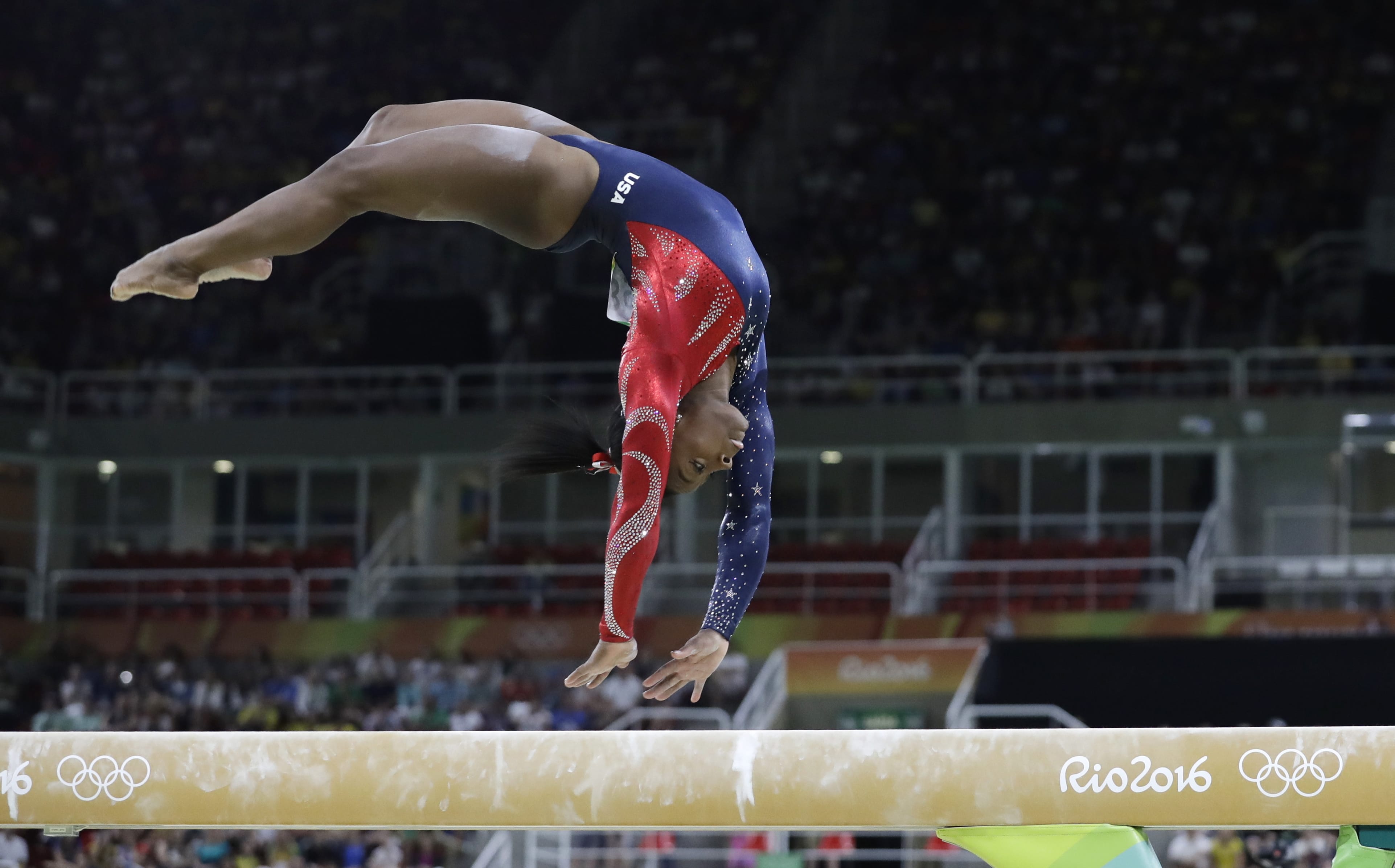 United States' Simone Biles performs on the balance beam during the artistic gymnastics women's qualification at the 2016 Summer Olympics in Rio de Janeiro, Brazil, Sunday, Aug. 7, 2016.