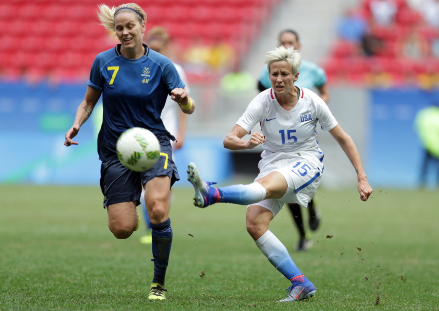 United States&#039; Megan Rapinoe kicks the ball past Sweden&#039;s Lisa Dahlkvist during a quarterfinal match of the women&#039;s Olympic football tournament Friday between the United States and Sweden in Brasilia. The U.S. lost after a penalty shoot-out.