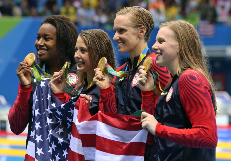 From right to left, United States&#039; Lilly King, Dana Vollmer, Kathleen Baker and Simone Manuel display their gold medals for the women&#039;s 4 x 100-meter medley relay final. The victory marked the 1,000th Olympic gold medal won by the United States since 1904.