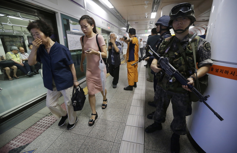 Mock subway passengers walk past South Korean army soldiers during an anti-terror drill as part of Ulchi Freedom Guardian exercise, at the Yoido Subway Station in Seoul, South Korea, on Tuesday. South Korea and the United States began their annual military drills Monday despite North Korea&#039;s threat of nuclear strikes in response to the exercises that it calls an invasion rehearsal.