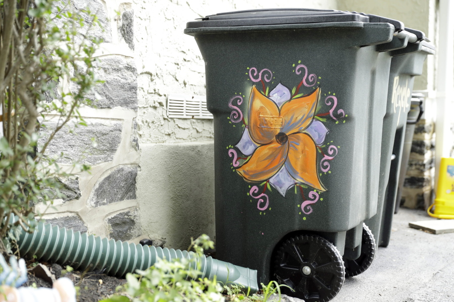 Esther Cohen-Eskin&#039;s garbage can was defaced with a large swastika, and then she repainted it as a flower. Her neighbors in Havertown, Pa., rallied around the Jewish family and also painted their trash cans to show their support.