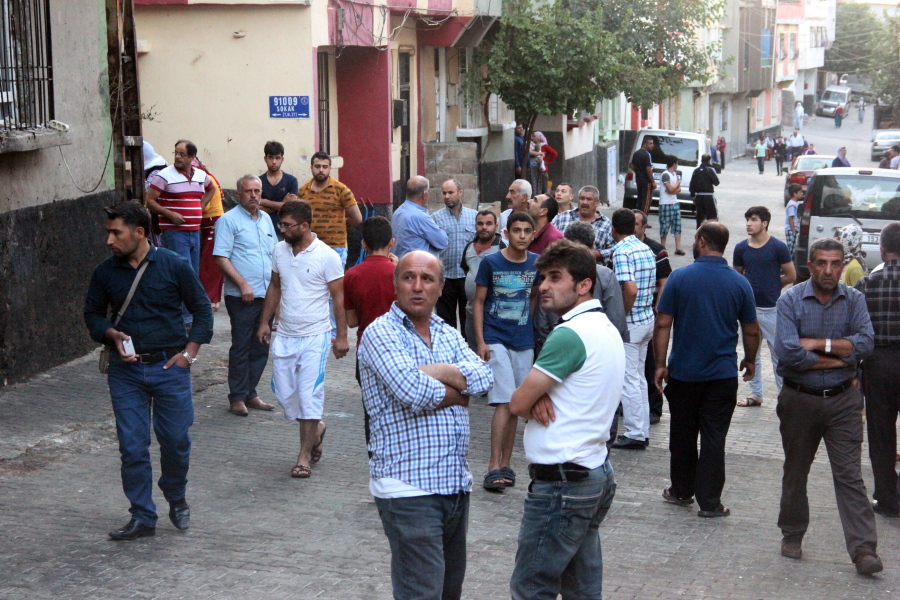 People gather to view damage just hours after Saturday&#039;s bomb attack in Gaziantep, southeastern Turkey, early Sunday, Aug. 21, 2016, targeting an outdoor wedding party in southeastern Turkey killed dozens of people and wounded dozens. Deputy Prime Minister Mehmet Simsek said the &quot;barbaric&quot; attack in Gaziantep, near the border with Syria, on Saturday appeared to be a suicide bombing. Turkish authorities have put a temporary ban on distribution of images relating to Saturday&#039;s Gaziantep attack within Turkey.
