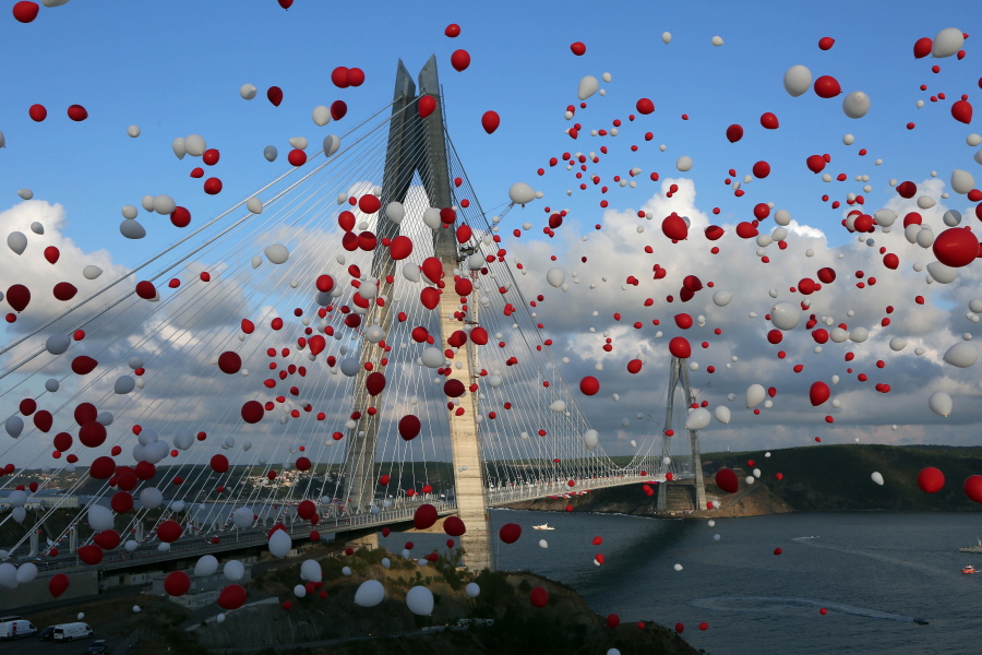 Red and white balloons, matching the colors of the Turkish flag, float away Friday during the inauguration of the Yavuz Sultan Selim Bridge in Istanbul, the third bridge over the Bosporus.