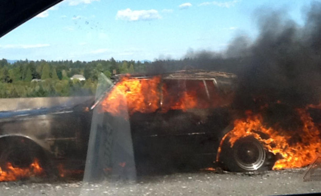 A car burns on the Interstate 205 bridge northbound Wednesday afternoon.