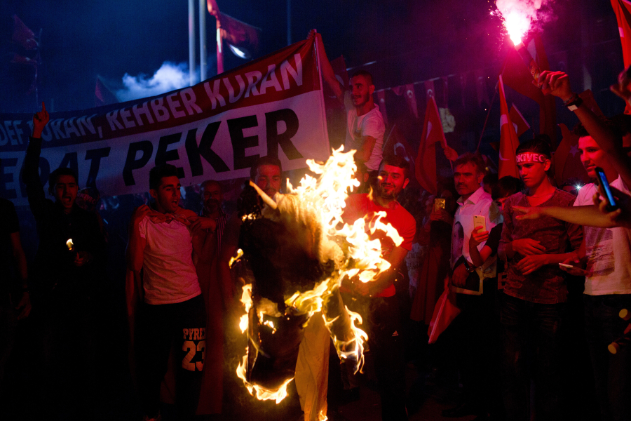 Supporters of Recep Tayyip Erdogan, Turkey&#039;s president, burn an effigy of the U.S.-based Islamic cleric Fethullah Gulen during a pro-government demonstration at Taksim Square in Istanbul on July 20.
