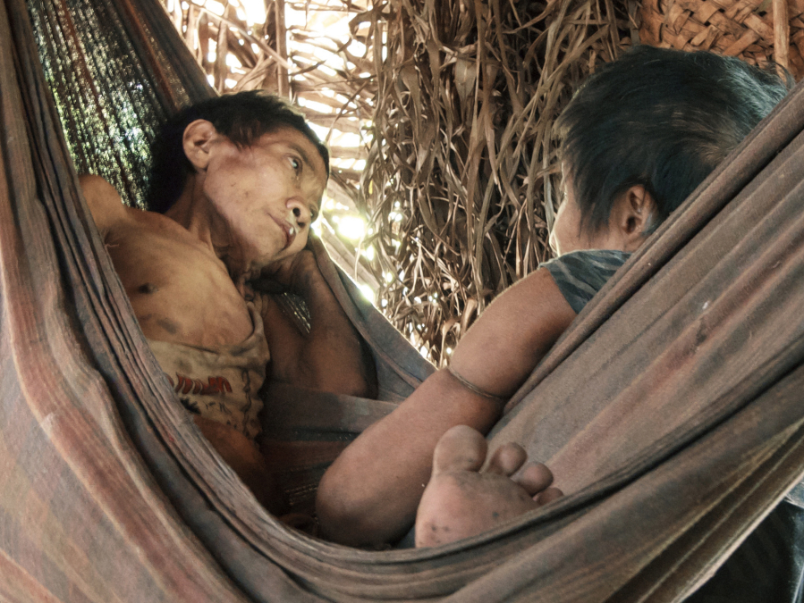 Jakarew&quot;ja and Amakaria, two women from the endangered Awá tribe from the Brazilian Amazon, pictured while sick with tuberculosis after being led out of the forest in this 2015 photo.