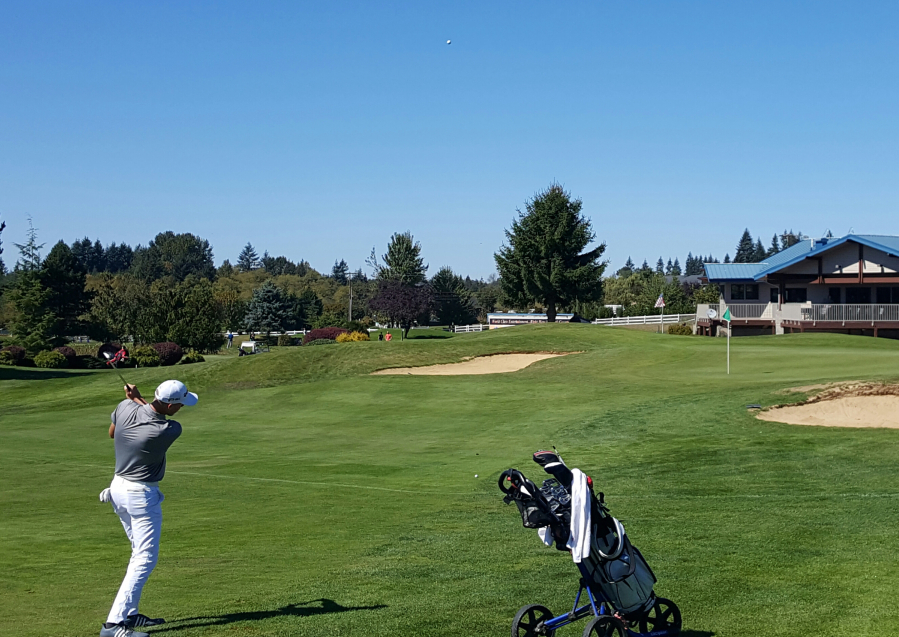 Spencer Tibbits of Fort Vancouver hits an approach shot at No. 18 at Tri-Mountain in the Jeff Hudson Invitational.