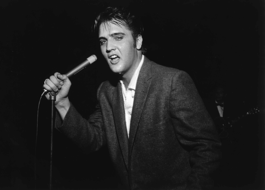 Elvis Presley performs in Bob Neal&#039;s Cotton Picking Jamboree for more than 7,000 people on May 15, 1956, at Ellis Auditorium in Memphis, Tenn.