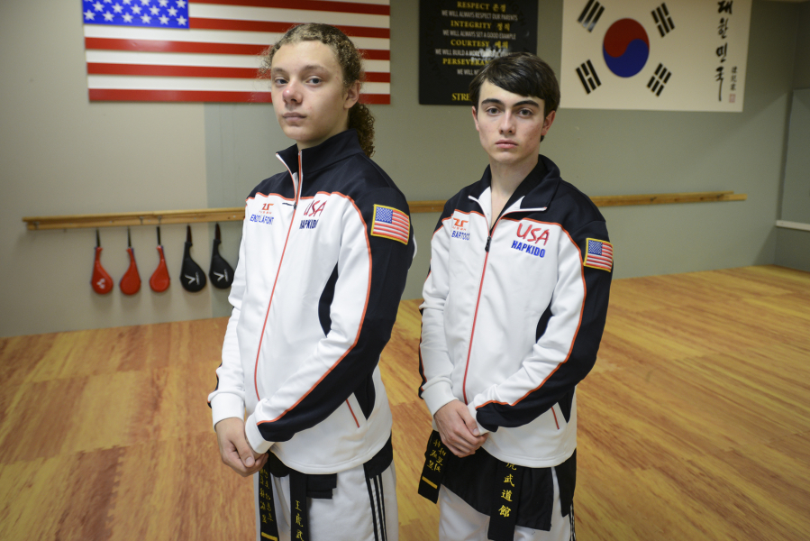 Sixteen-year-old Enzo LaFont, left, and 17-year-old Aiden Bartocci, right, take a break during practice at King Tiger Martial Arts in Vancouver.