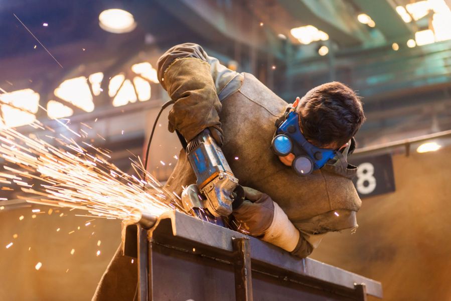 A man wears protective goggles welding but not hearing protection. Hearing damage is the most common workplace injury, according to the Centers for Disease Control.