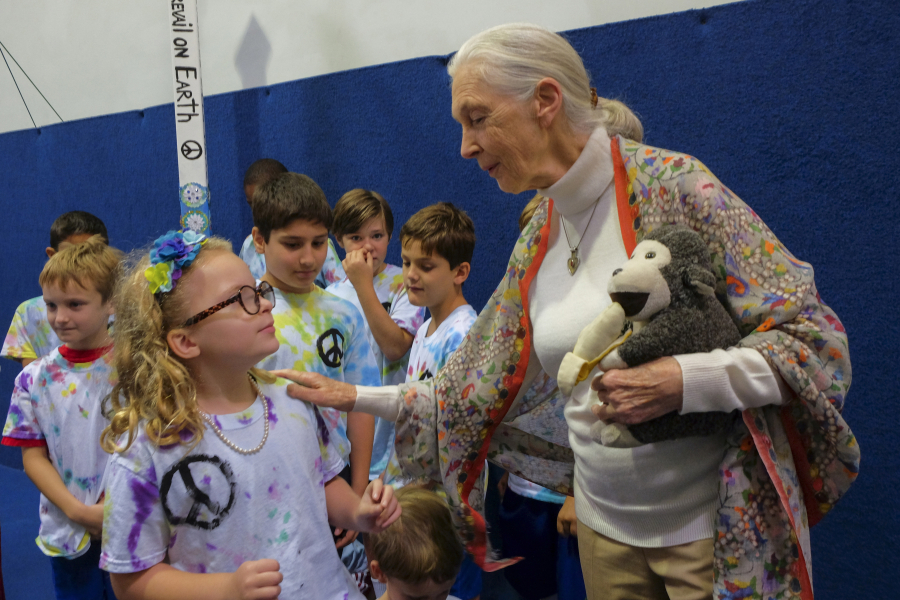 Conservationist and primatologist Jane Goodall, 82, speaks to second-grader Lillian Sayer, 7, at the private Newton School on Tuesday in Sterling, Va.