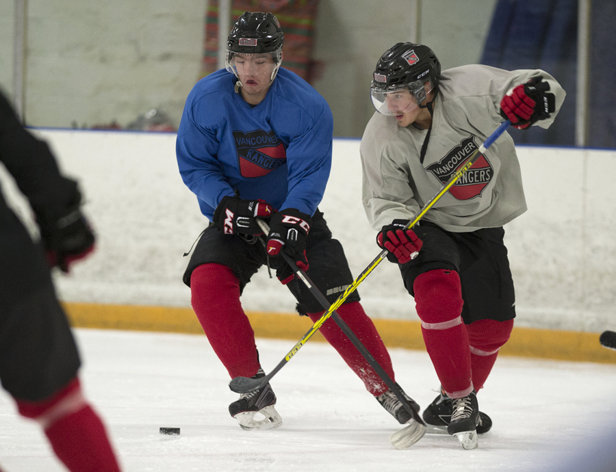 Rangers&#039; Bryce Ebert, left, battles teammate Nic Moulding during practice at Mountain View Ice Arena on Wednesday afternoon, Sept.