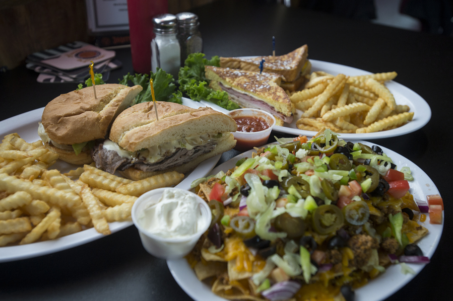A Philly Steak San, from left, is served with nachos and a Monte Cristo sandwich at Orchards Tap.