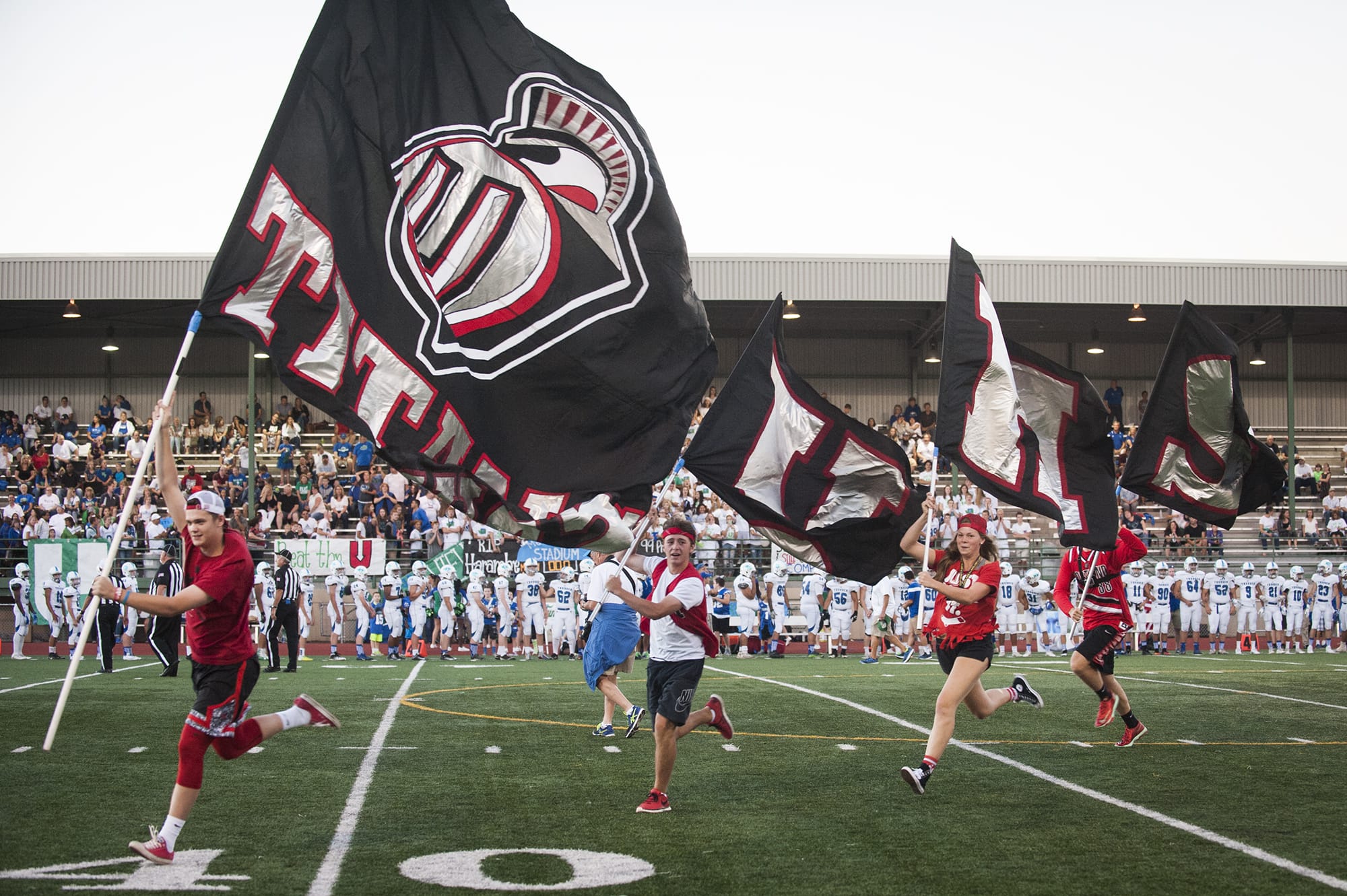 Union fans run across the field before the game against Mountain View, Friday September 9, 2016, at McKenzie Stadium.