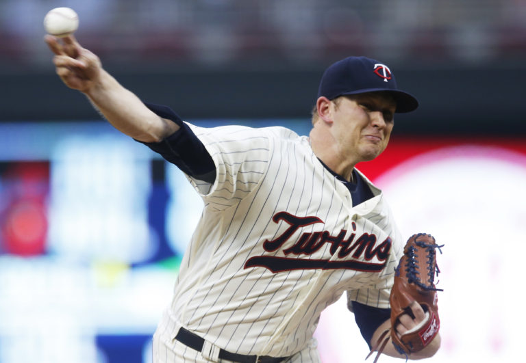 Minnesota Twins pitcher Tyler Duffey throws against the Seattle Mariners during the first inning of a baseball game Saturday, Sept. 24, 2016, in Minneapolis.