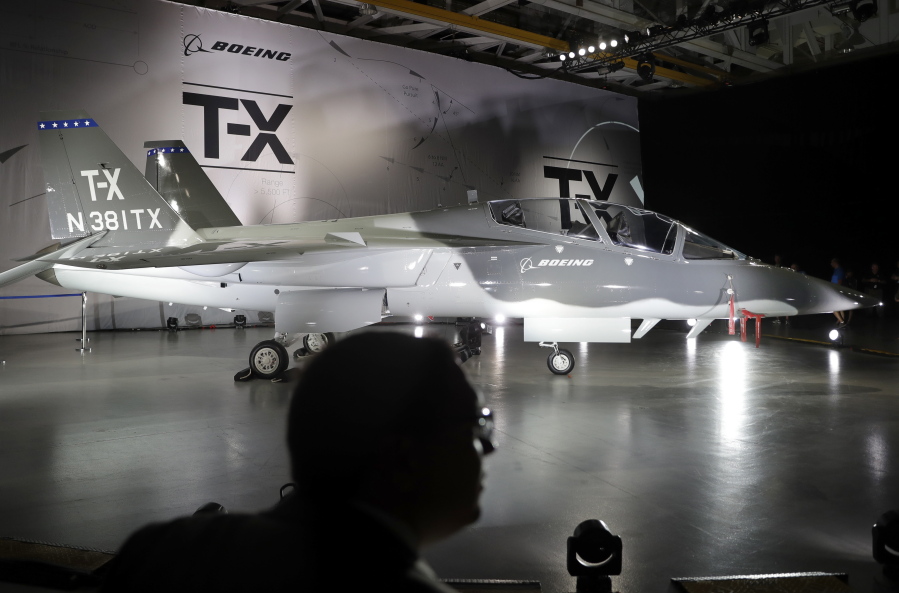 Boeing&#039;s T-X aircraft is shown during an event to reveal the proposed trainer Tuesday in St. Louis. Boeing and its partner Saab are competing against several other military contractors to win the bid to build a replacement for the aging T-38 used by the U.S. Air Force to train pilots.