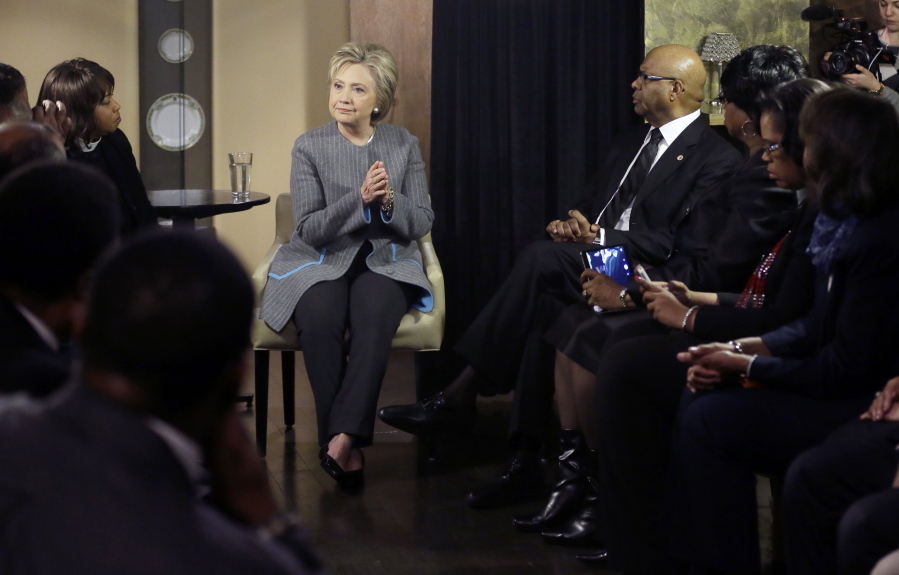 Democratic presidential candidate Hillary Clinton speaks with African American ministers, in Detroit.