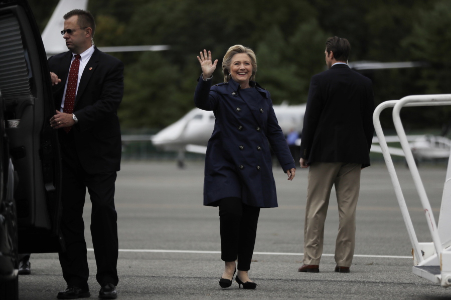 Democratic presidential candidate Hillary Clinton waves before boarding her campaign plane at Westchester County Airport in White Plains, N.Y., on Wednesday.