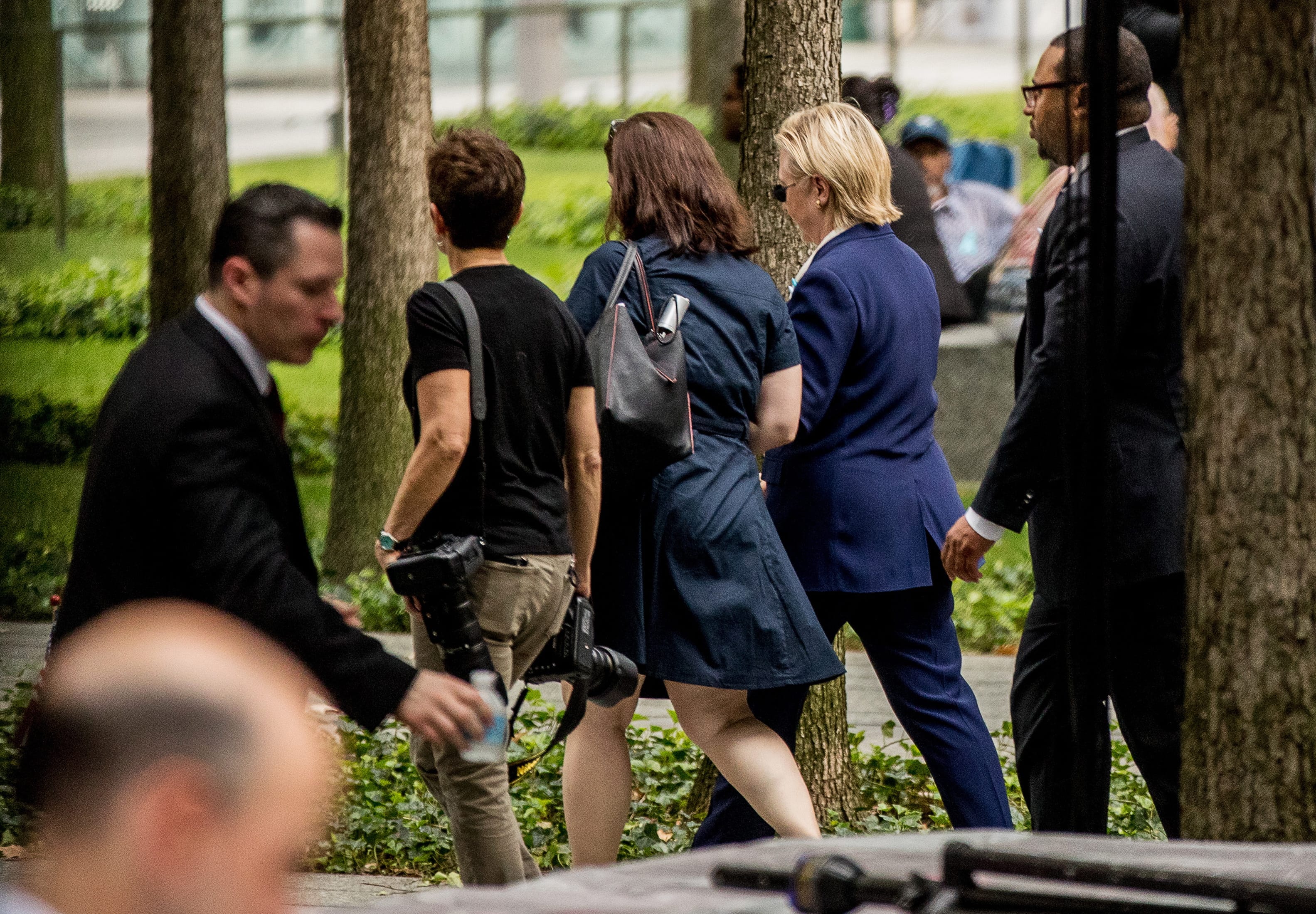Democratic presidential candidate Hillary Clinton, second from right, departs after attending a ceremony at the Sept. 11 memorial, in New York, Sunday, Sept. 11, 2016, on the 15th anniversary of the Sept. 11 attacks.