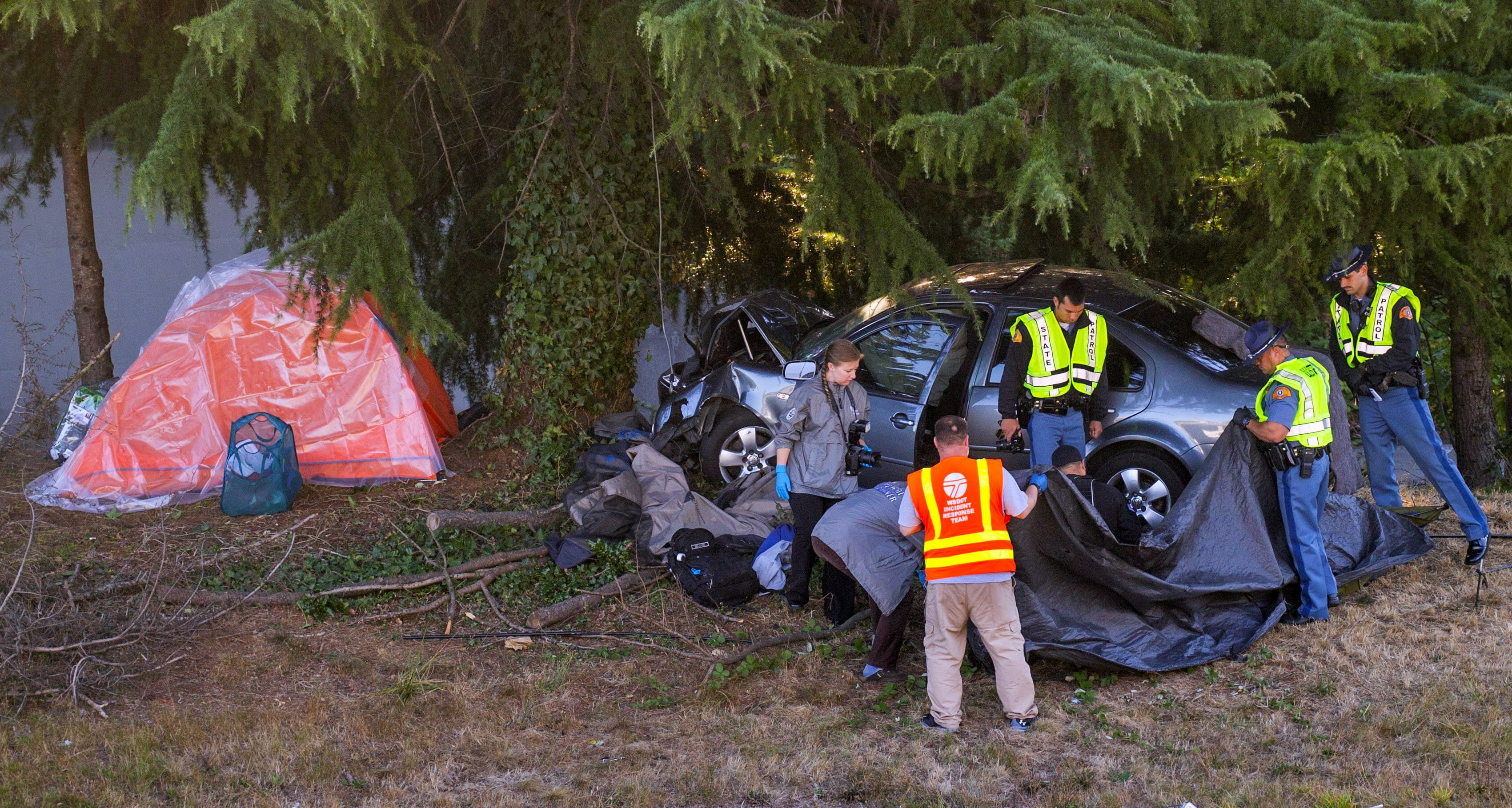 One person was killed when a car crashed into a tent near the Northeast 50th Street off-ramp near Seattles University District on Monday, Sept. 12, 2016. The driver was taken into custody and is under investigation of vehicular homicide, police said.