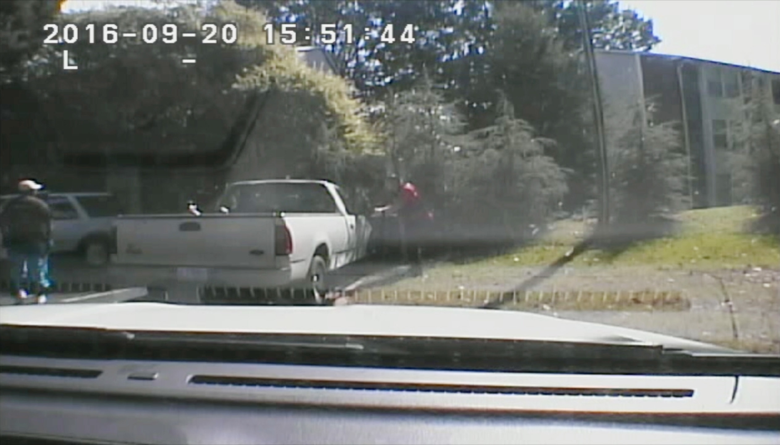This image made from video provided by the Charlotte-Mecklenburg Police Department on Saturday, Sept. 24, 2016 shows Keith Scott, left, moments before he was fatally shot by police in Charlotte, N.C., on Sept. 20, 2016.