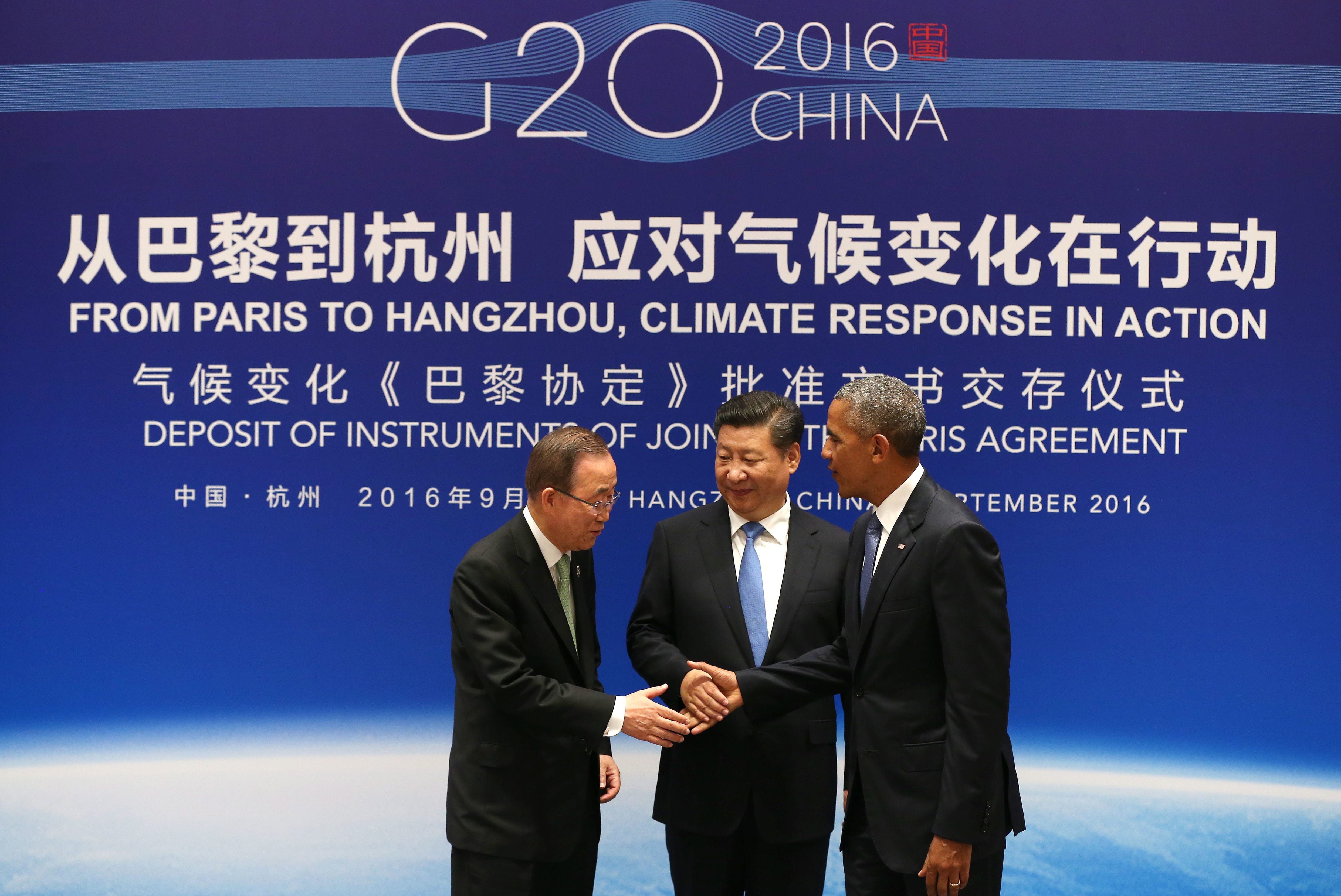 Chinese President Xi Jinping, center, U.S. President Barack Obama, right, and U.N. Secretary-General Ban Ki-moon shake hands during a joint ratification of the Paris climate change agreement at the West Lake State Guest House in Hangzhou in eastern China's Zhejiang province, Saturday, Sept. 3, 2016.