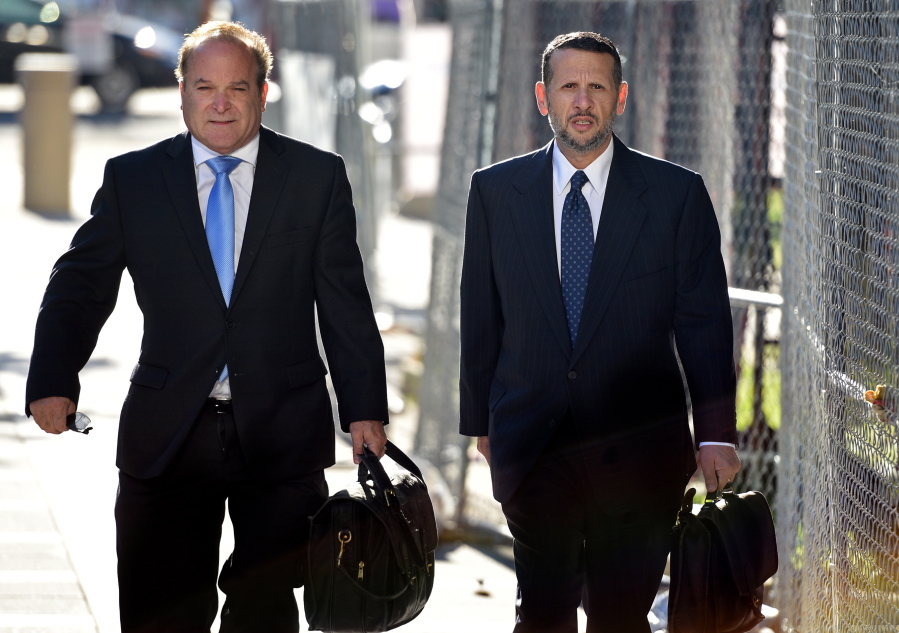 David Wildstein,right, former Port Authority appointee of New Jersey Gov. Chris Christie, arrives at the  Martin Luther King Jr. Federal Courthouse with his attorney Alan Zegas, left, on Monday. Wildstein will continue to testify in the Bridgegate trial.