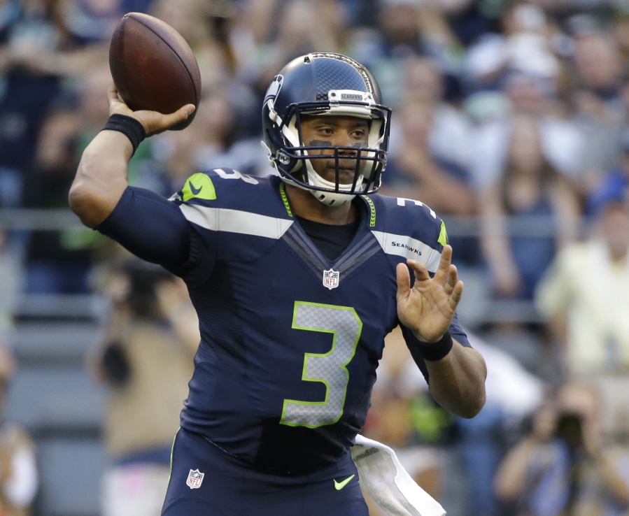 Seattle Seahawks quarterback Russell Wilson passes against the Dallas Cowboys during the first half of a preseason NFL football game, Thursday, Aug. 25, 2016, in Seattle.