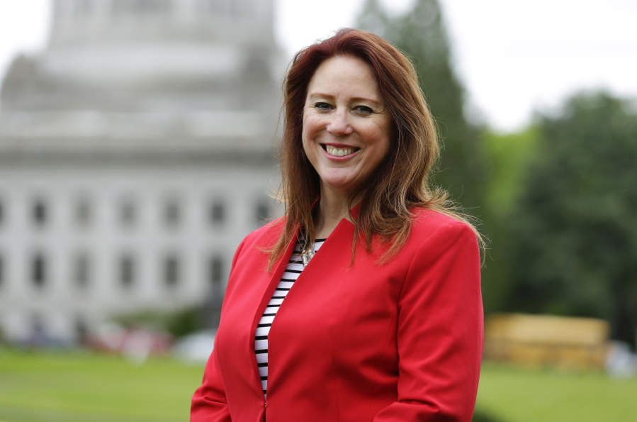 FILE - In this May 4, 2016 file photo, Washington Secretary of State Kim Wyman poses for a photo at the Capitol in Olympia, Wash. A Republican has overseen Washington state elections for over 50 years despite Democrats dominating most other statewide offices, and Secretary of State Wyman -- currently the lone statewide elected Republican not only in Washington state, but the entire west coast -- faces a challenge from Democrat Tina Podlodowski, a former Microsoft manager who served as an adviser to current Seattle Mayor Ed Murray in 2014. (AP Photo/Ted S.