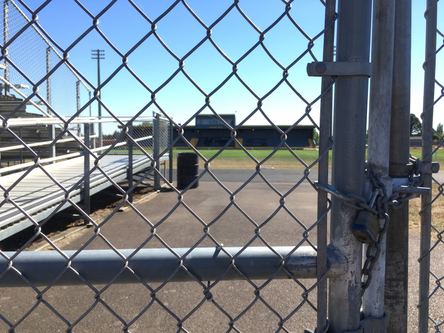 The gate is locked to Philomath High School at the entrance to the football field and track in Philomath, Ore. One of the town&#039;s biggest events is Friday night football games, but football season has been canceled at the high school in the midst of a hazing episode.