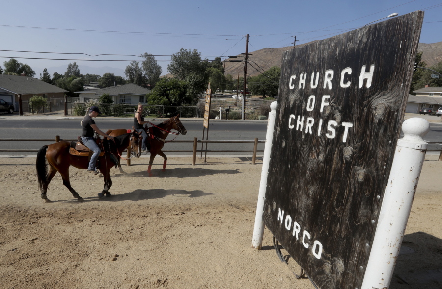 Women on horseback ride in Norco, Calif. The Southern California city has rejected plans for a proposed Hindu cultural center partly because officials say the large, domed building doesn&#039;t fit in with its Old West motif.