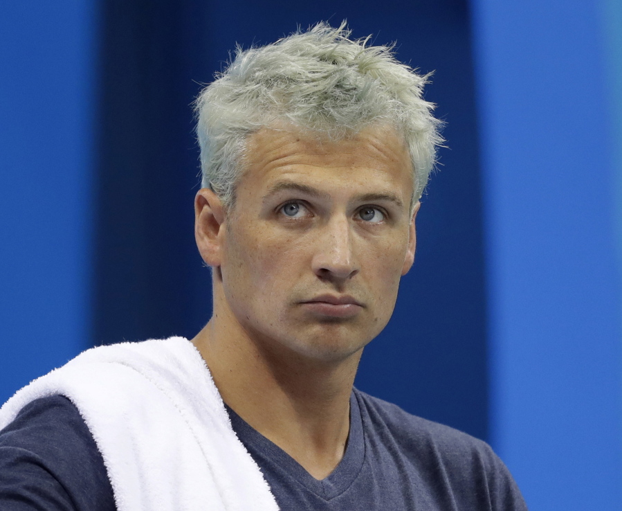 United States&#039; Ryan Lochte prepares before a men&#039;s 4x200-meter freestyle heat at the 2016 Summer Olympics, in Rio de Janeiro, Brazil, on Aug. 9. Lochte is banned from swimming through next June and will forfeit $100,000 in bonus money that went with his gold medal at the Olympics, part of the penalty for his drunken encounter at a gas station in Brazil during last month&#039;s games. The U.S. Olympic Committee and USA Swimming announced the penalties Thursday. Sept. 8, 2016.