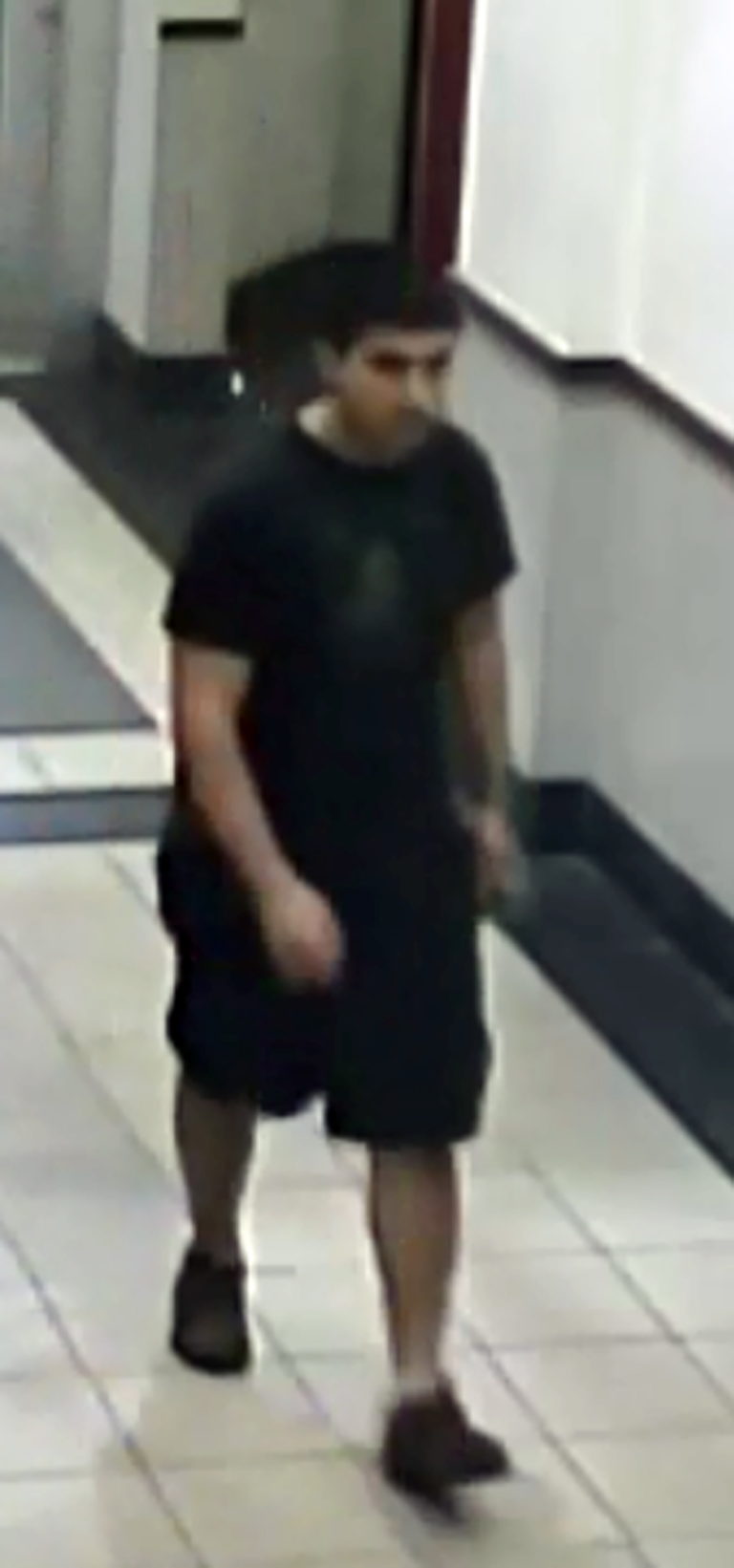 This Friday, Sept. 23, 2016 frame from surveillance video provided by the Washington State Patrol shows the suspect in a shooting rampage at the Cascade Mall in Burlington, Wash., as authorities seek the public's help in identifying and locating him.  The weapon was recovered but the suspect remained at large early Saturday.