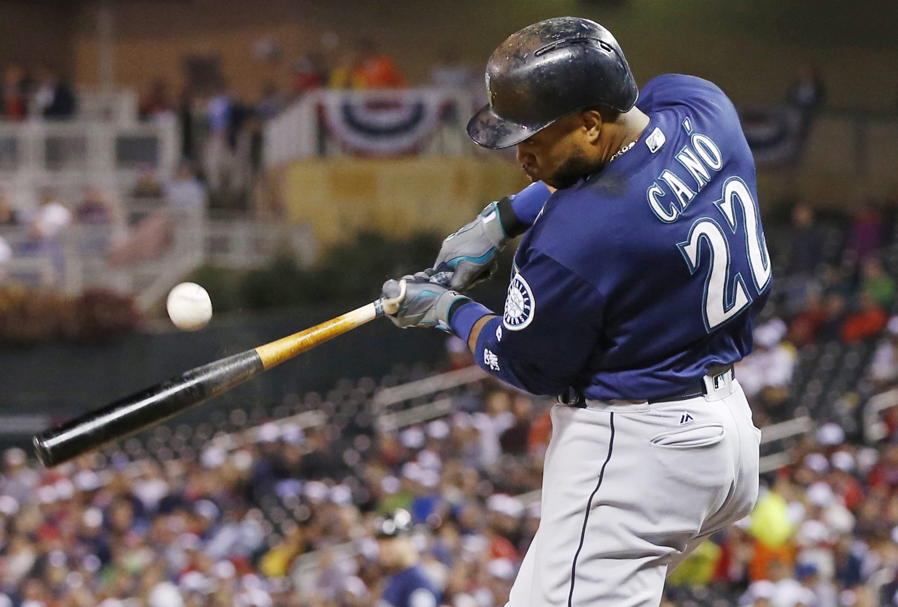 Seattle Mariners' Robinson Cano hits an RBI single off Minnesota Twins pitcher Kyle Gibson during the third inning of a baseball game Friday, Sept. 23, 2016, in Minneapolis.