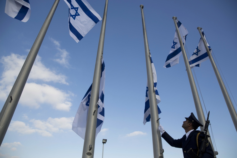 A member of the Knesset guard lowersIsraeli flags to half-staff in preparations to display the coffin of former Israeli President Shimon Peres at the Knesset, Israel&#039;s Parliament, in Jerusalem, Wednesday. The country mourned the death of Peres, a former president and prime minister whose life story mirrored that of the Jewish state, as the government began preparations for a funeral that is expected to bring together world leaders and dignitaries. Israeli officials are feverishly preparing security arrangements and logistics to host an array of world figures arriving in Israel for Peres&#039; funeral Friday.