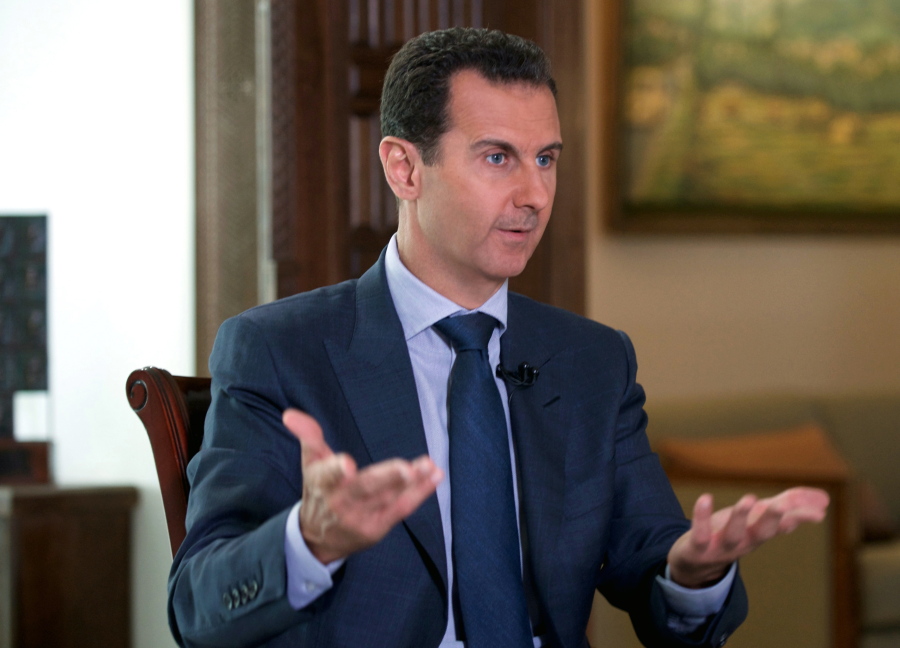 Syrian President Bashar Assad speaks to The Associated Press at the presidential palace in Damascus, Syria.
