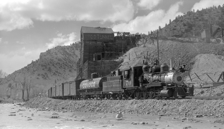 In this 1941 photo provided by the Denver Public Library Western History Collection, a Colorado &amp; Southern narrow-gauge freight train stands outside the Argo Mill and Tunnel complex in Idaho Springs, Colo. The mill and tunnel complex are part of an extensive Superfund cleanup.