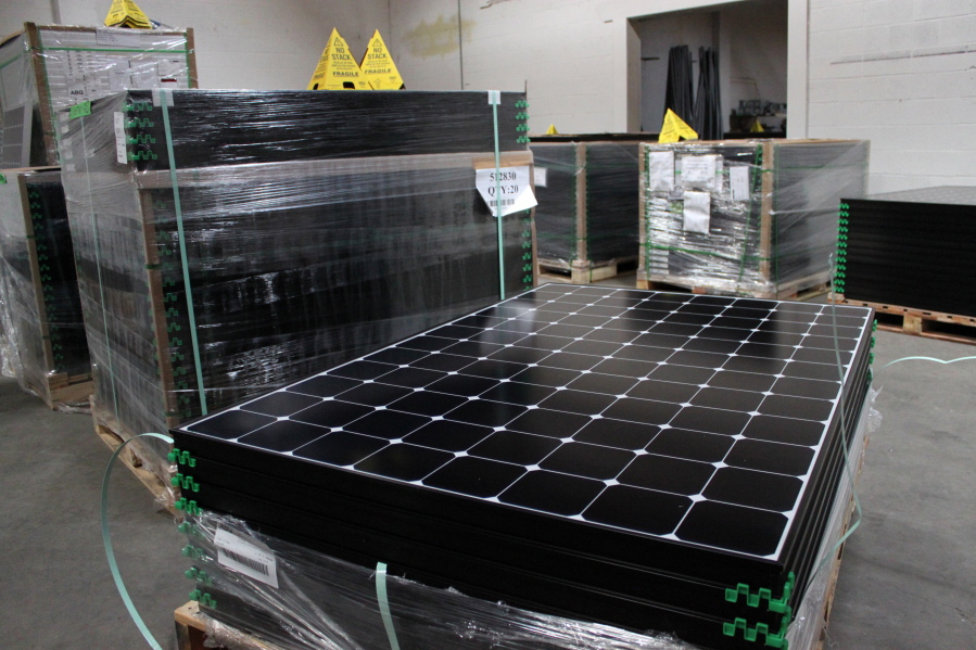 The latest generation of SunPower solar panels are stacked in Positive Energy Solar&#039;s warehouse in Albuquerque, N.M.