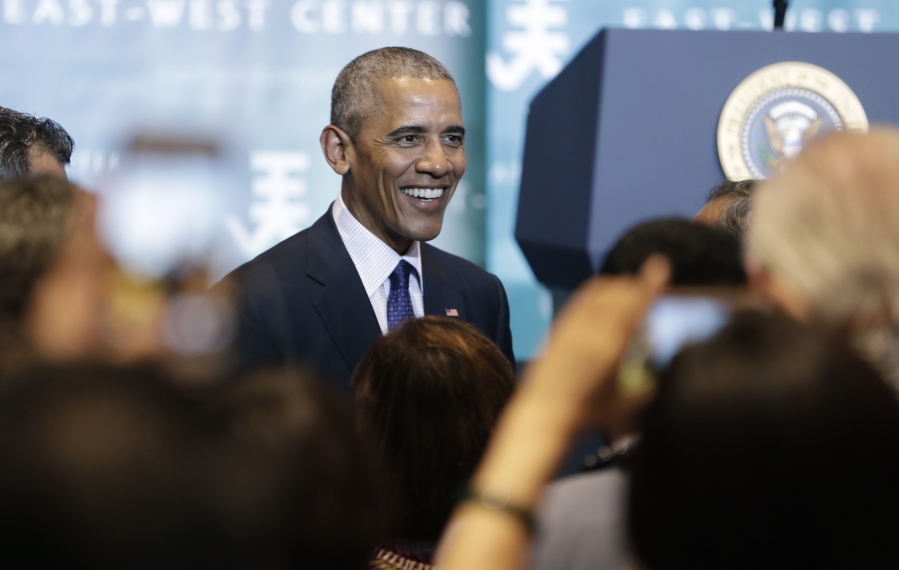 President Barack Obama greets people in the audience after speaking to the 2016 Pacific Islands Conference of Leaders at the East West Center, in Honolulu, on Wednesday.